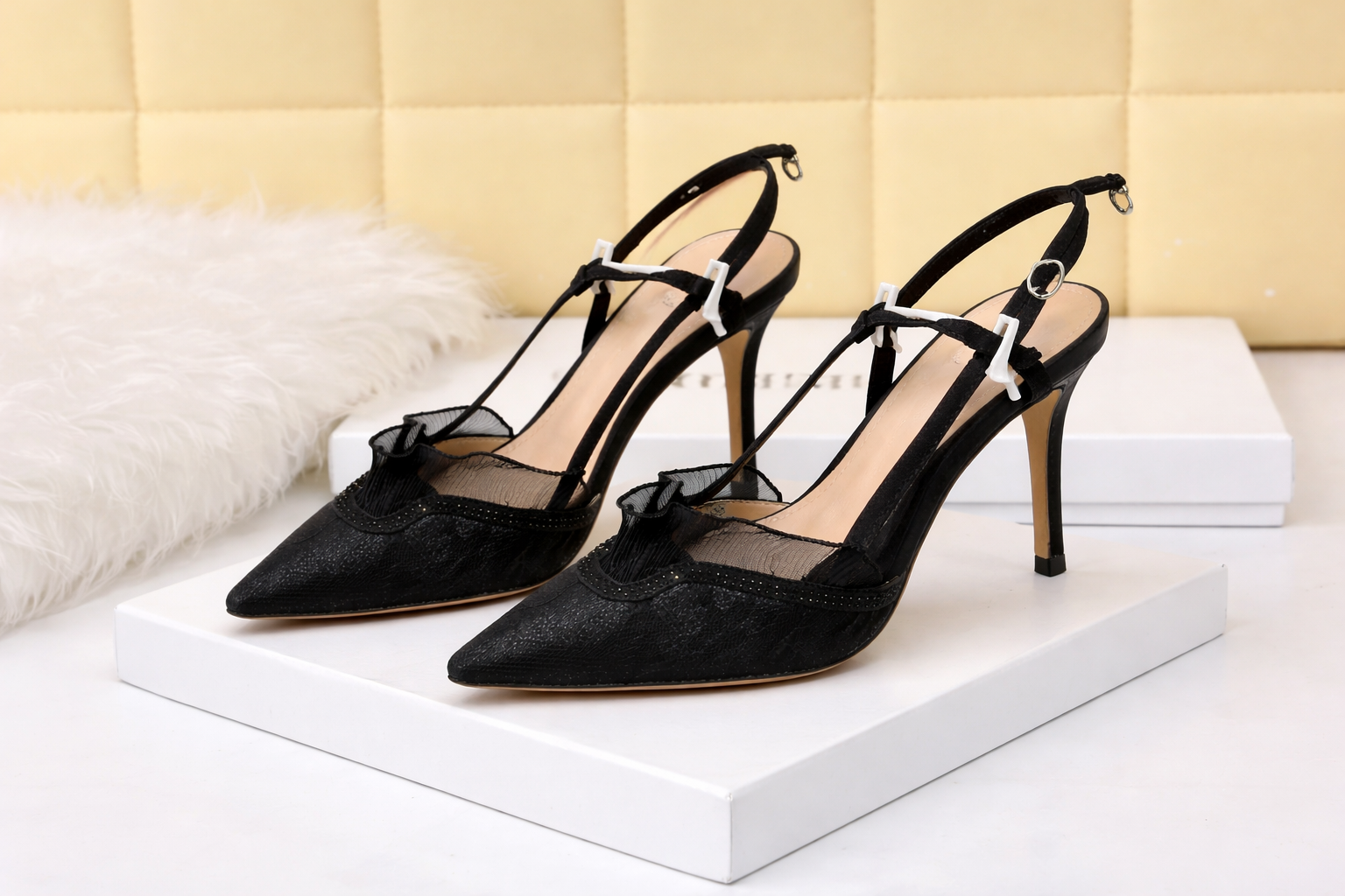 Black bow slingback stiletto pumps